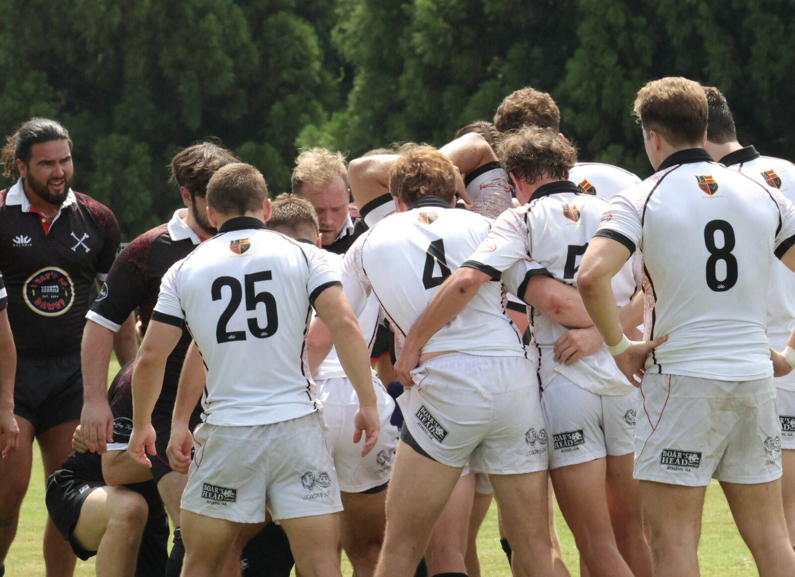 UGA men in the huddle during their alumni match in Athens. Photo: @onyxx.jpeg / Instagram.